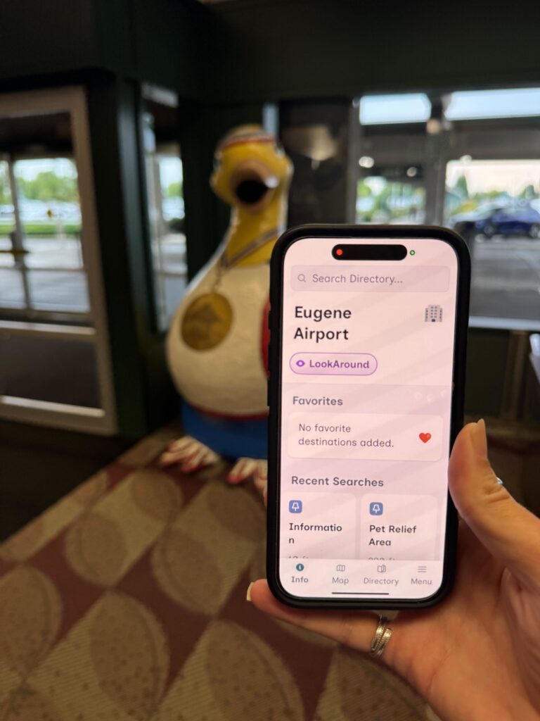 The GoodMaps app displays EUG Airport on its screen.