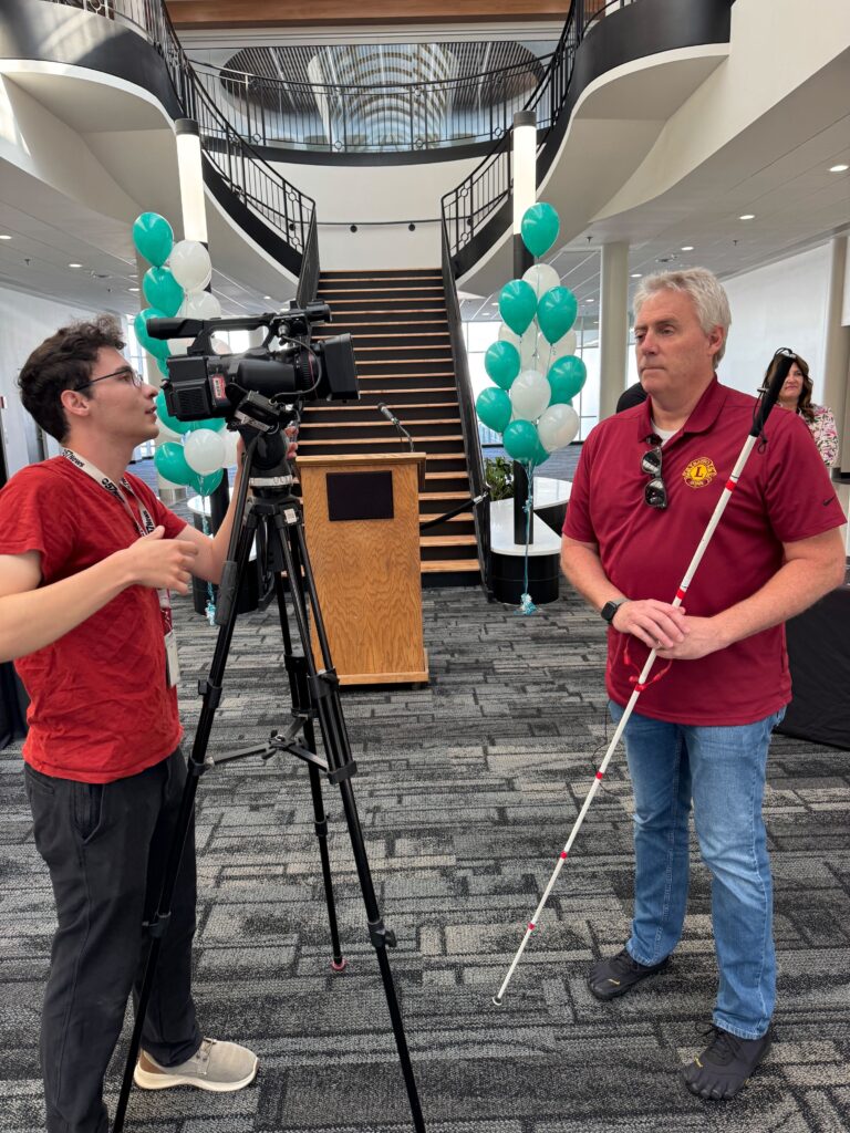 A user who is blind is being interviewed about the launch of GoodMaps at SBN.